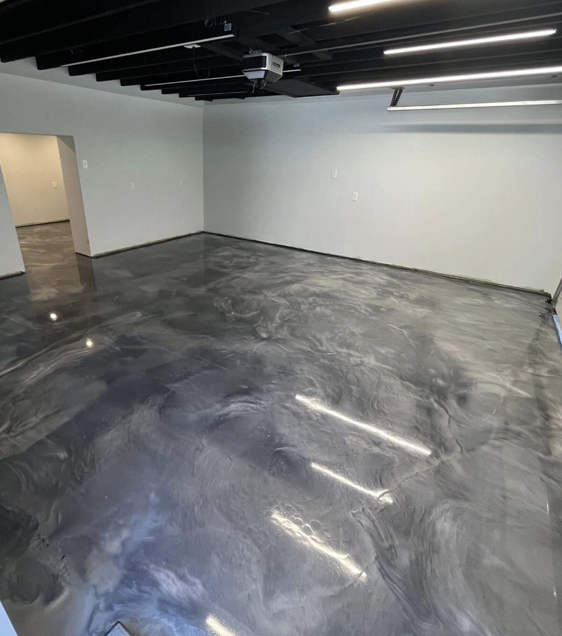 Grey metallic epoxy floor in an interior room by Titan Floor Systems